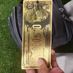 Sprayground Gold Dollar Tag